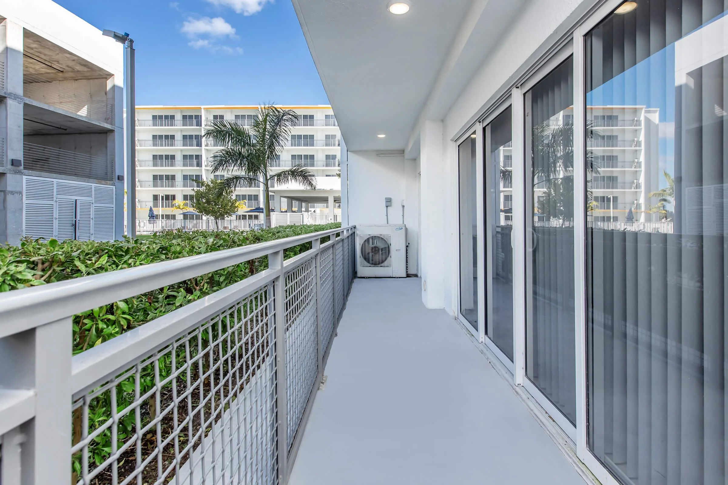 Private balcony overlooking the Modern Towers courtyard.